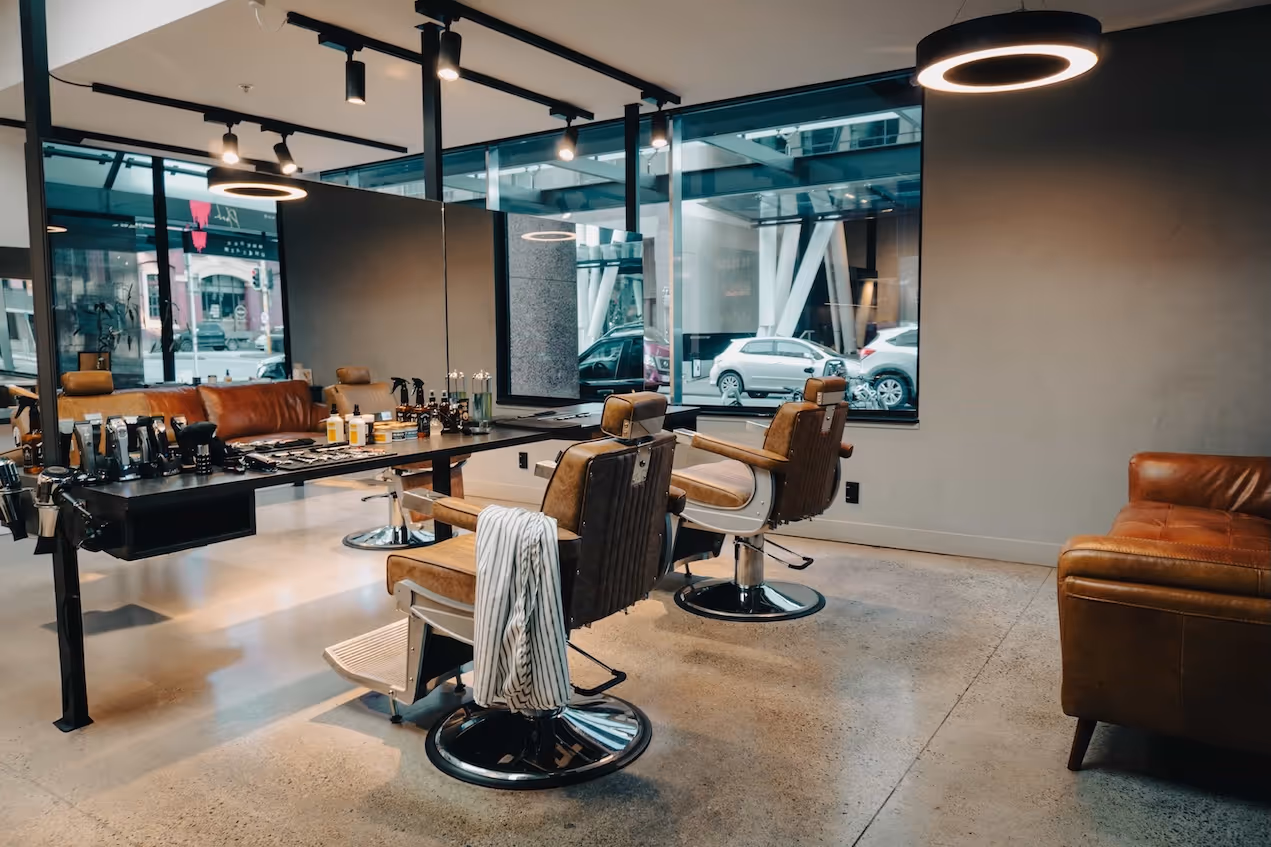 A view of the barbershop from the entrance, showcasing the full layout and design.